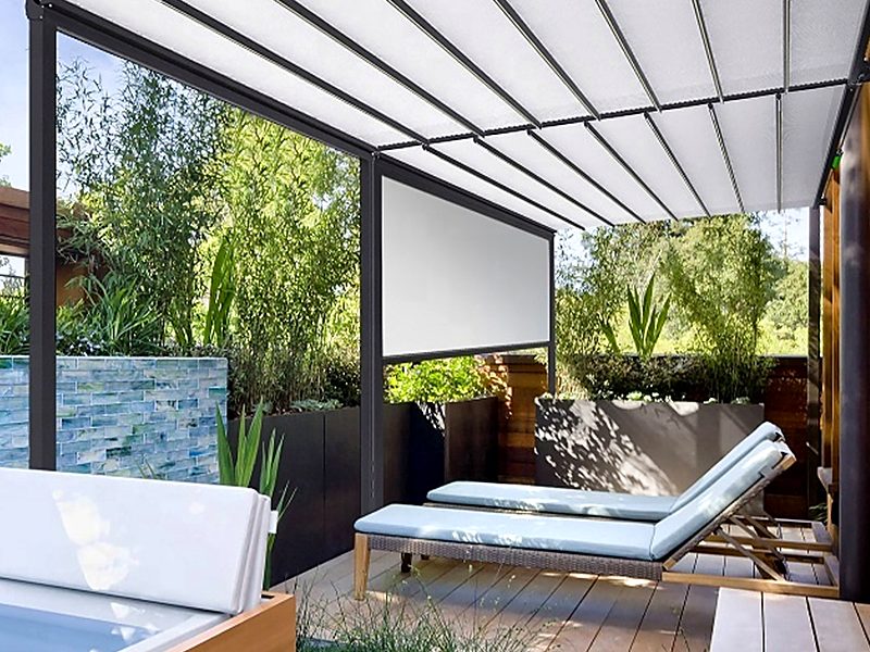 A white retractable fabric roof over sun loungers and a hot tub, with a zip screen lowered at the far end